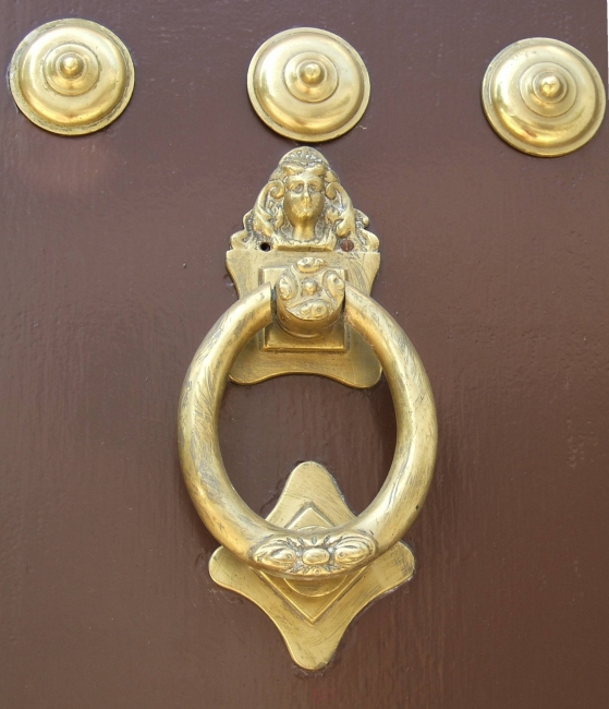 Door knocker from door with ornate inner door